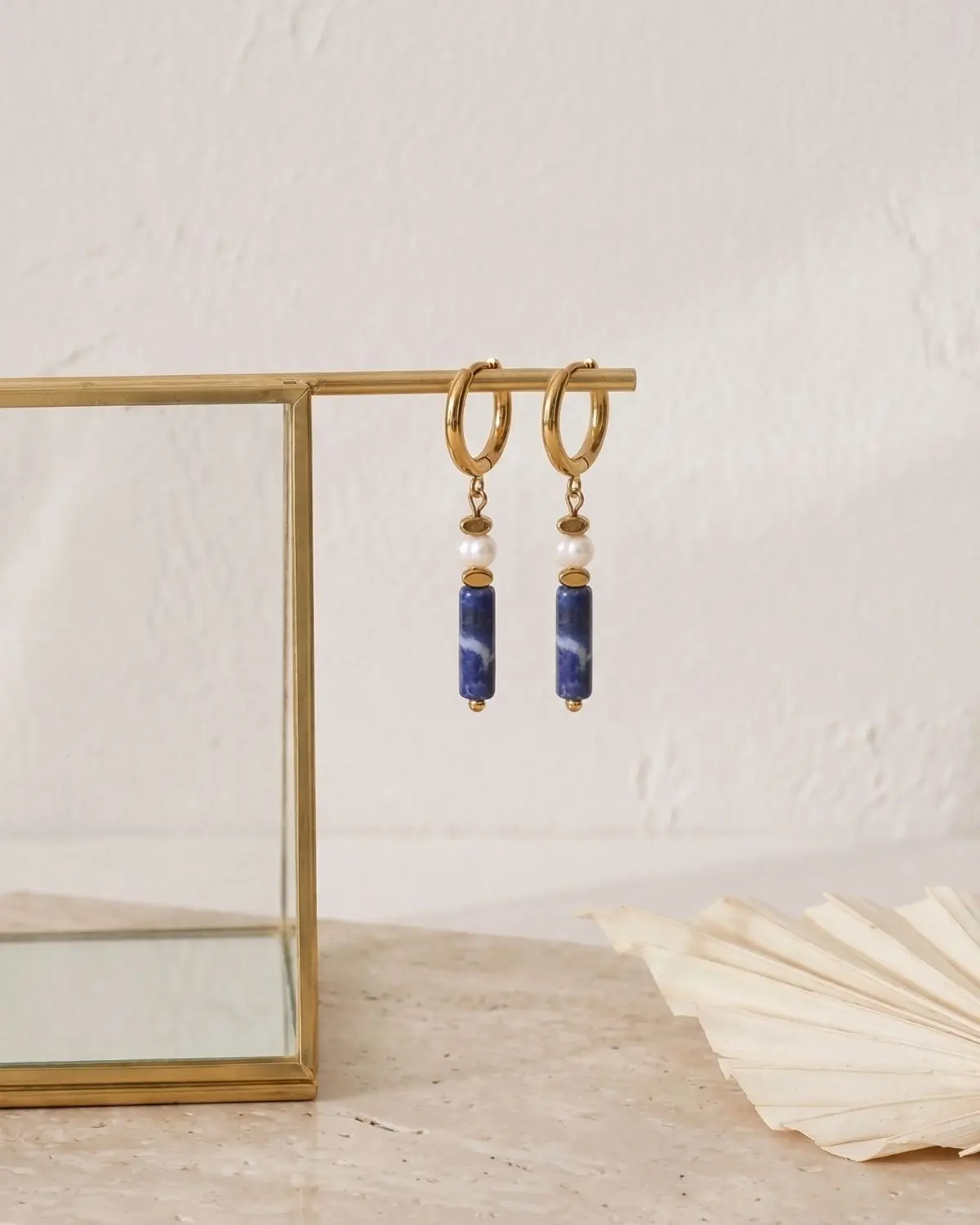 The-Gem-Stories-Lapis-Lazuli-Hematite-Earrings-concept1 Handmade Lapis Lazuli Pearl Drop Earrings Concept 1 featuring deep blue lapis lazuli gemstones and elegant pearl accents.