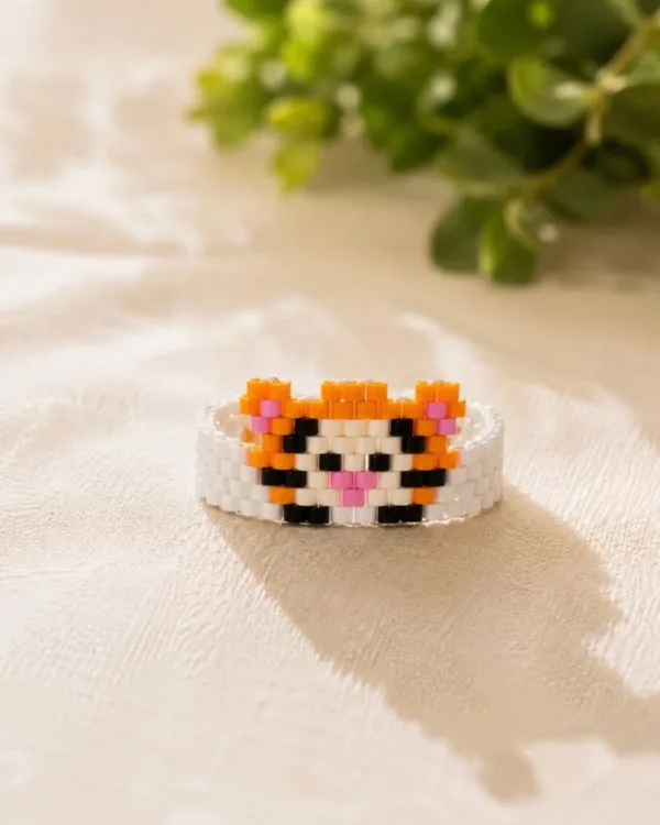 Handmade Tiny Tiger bracelet crafted with orange, black, and white Miyuki delica beads by The Gem-Studio.