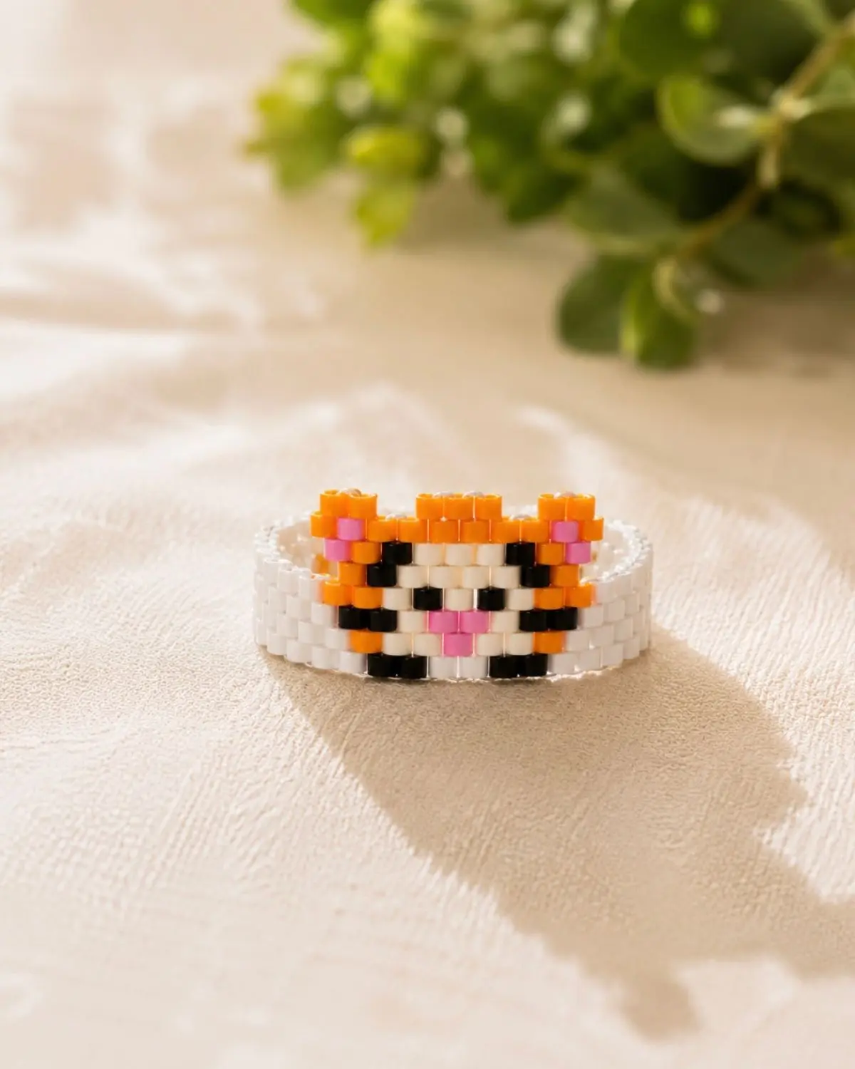 Tiny Tiger Handmade Tiny Tiger bracelet crafted with orange, black, and white Miyuki delica beads by The Gem-Studio.