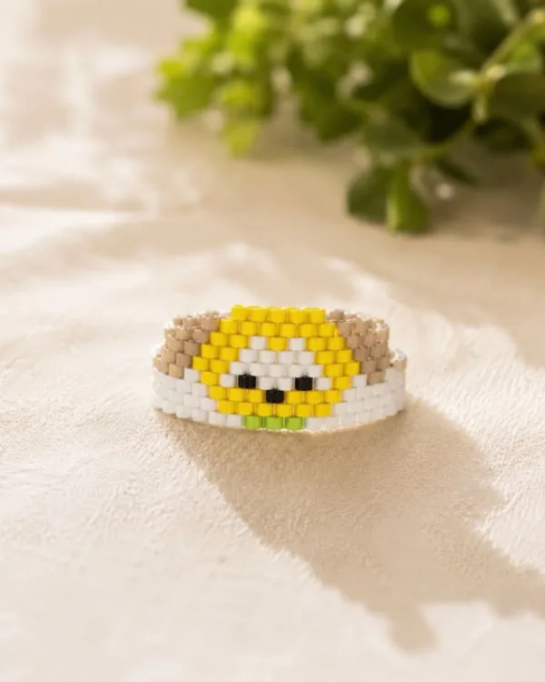 Handmade Tiny Pluto bracelet crafted with yellow, white, and brown Miyuki delica beads featuring a cute dog design.