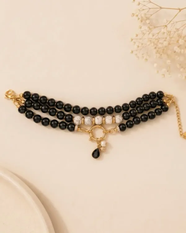 Close up of handmade multilayer black and white marble bracelet by The Gem Stories
