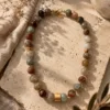 The Gem Stories Terra Agate Necklace featuring natural agate stones in warm earthy tones and an elegant handcrafted design.