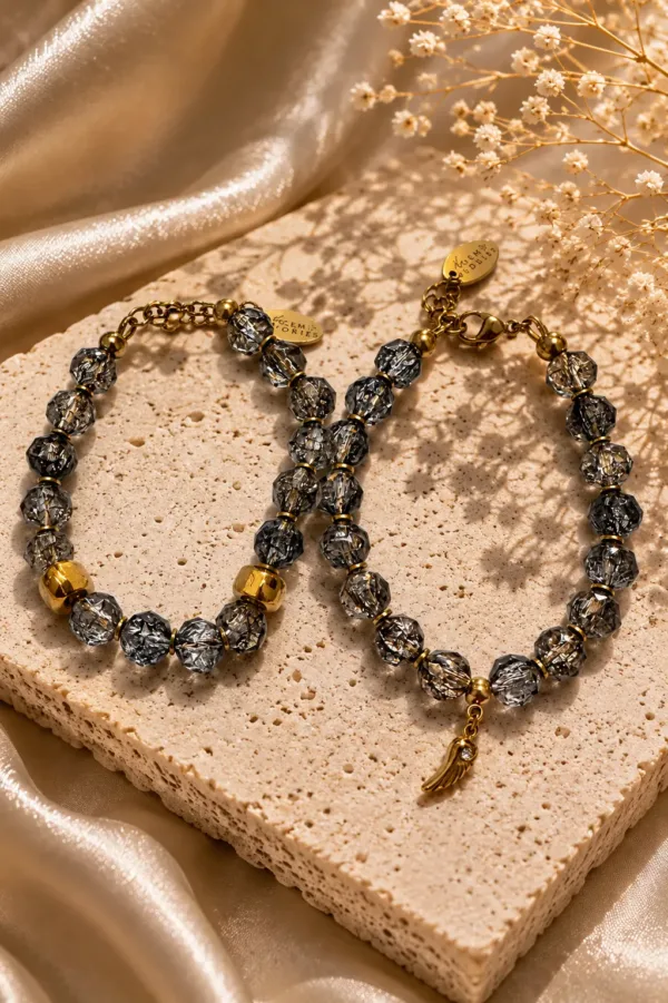 Wings of Light Bracelets with faceted crystal beads, golden details and delicate wing charms by The Gem Stories
